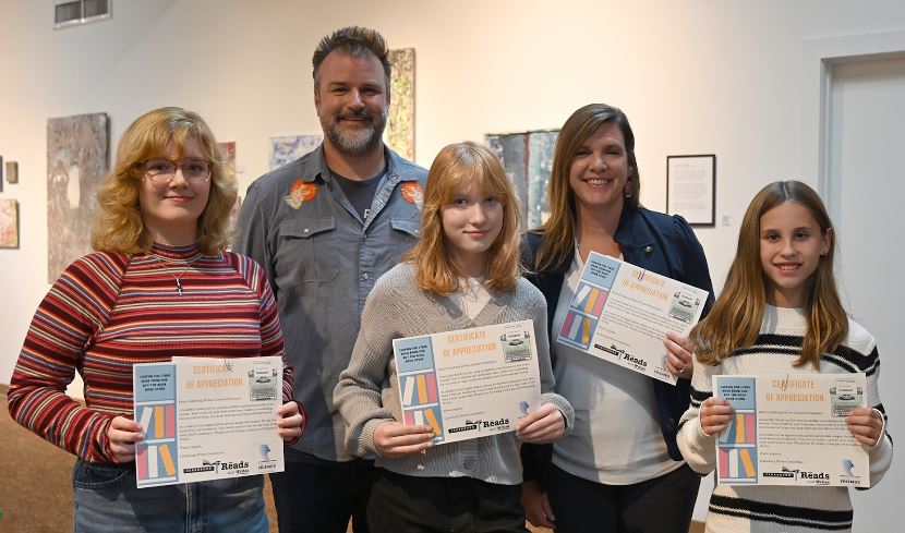 Junior Ellie Lisiecki (left) and Writing Center teacher Deb Krygiel (second from right) were among the winning writers.                                    
     
Cedarburg Public Library photo