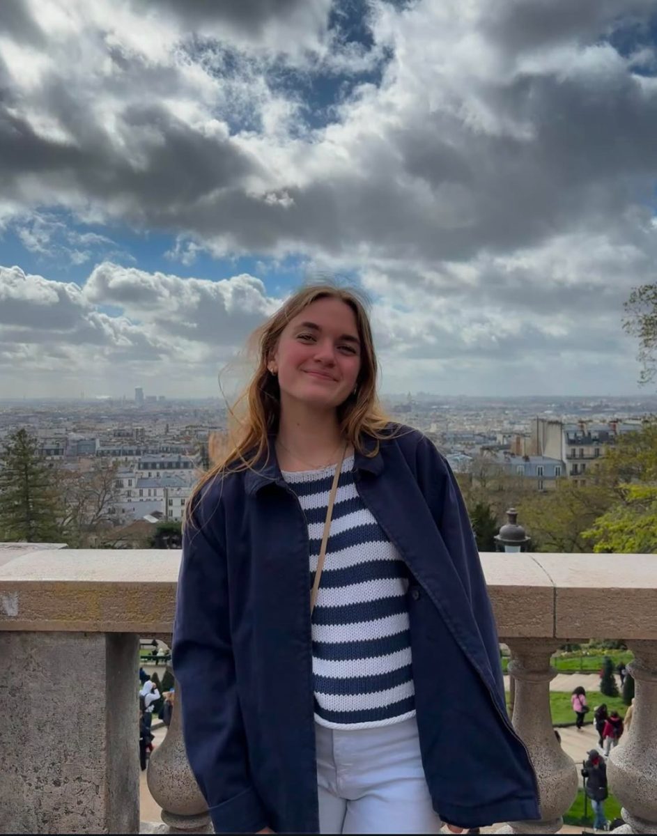 One of senior Hailey Roob's interests in traveling, shown by the view of Paris in the background.